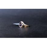 Gemporia - A Bengal iolite and white zircon 9k gold ring,