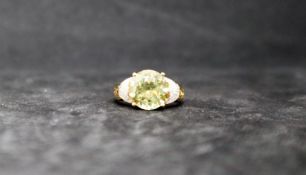 Gemporia - An 18k gold 5.50ct csarite and diamond ring set with 52 diamonds totalling .