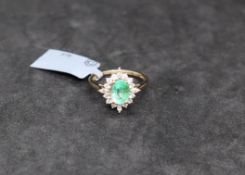 Gemporia - A Colombian emerald and white zircon 9k gold ring,