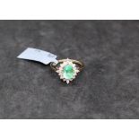 Gemporia - A Colombian emerald and white zircon 9k gold ring,