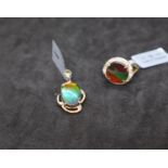 Gemporia - An ammolite and white zircon 9k gold pendant together with an ammolite and white zircon