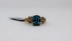 Gemporia - A Ratanakiri blue and white zircon 9k gold ring,