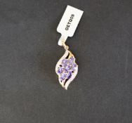 Gemporia - A "The Merelani Miracle" tanzanite and white zircon 9k gold pendant set with seven oval