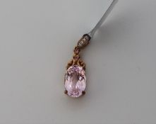 Gemporia - A kolum kunzite, pink sapphire and white zircon 9k gold pendant, set with a 4.