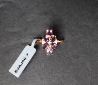 Gemporia - A Mahenge purple spinel and white zircon 9k rose gold ring,