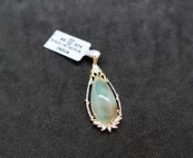 Gemporia - An aquaprase and white zircon 9k gold pendant, set with a 10.