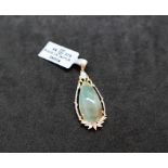 Gemporia - An aquaprase and white zircon 9k gold pendant, set with a 10.