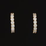 Ladies' Pair of Gold and Diamond Scroll Earrings