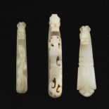 A Group of Three Carved Jade Belt Hooks