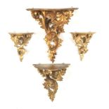 Group of Four Baroque Style Gilt Carved Wood Graduated Size Wall Brackets