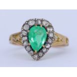 ANTIQUE EMERALD AND DIAMOND CLUSTER RING