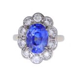 IMPORTANT 6.32 ct. CEYLON BLUE SAPPHIRE AND DIAMOND CLUSTER RING