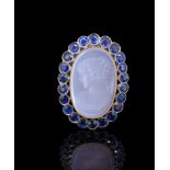 AN ANTIQUE MOONSTONE CAMEO AND SAPPHIRE PENDANT