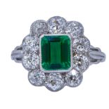 IMPORTANT 1.55 ct. COLOMBIAN EMERALD AND DIAMOND CLUSTER RING