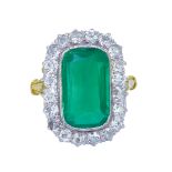 IMPORTANT 5.38 CT. COLOMBIAN EMERALD AND DIAMOND CLUSTER DRESS RING