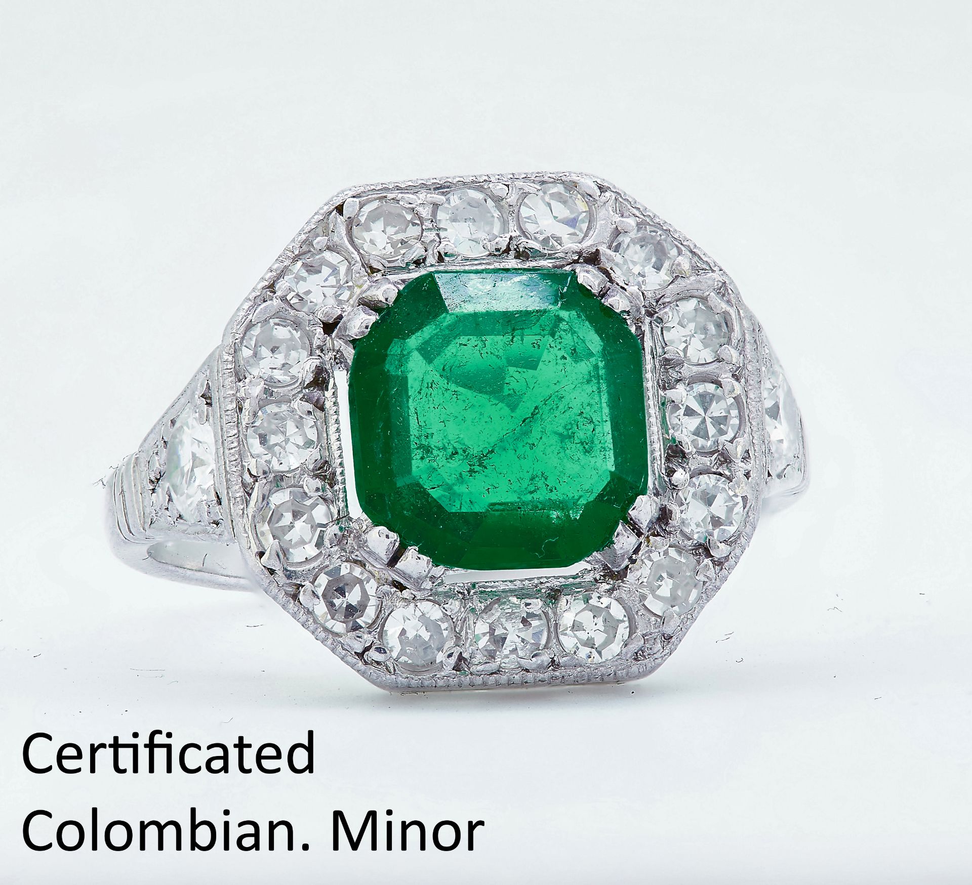 IMPORTANT COLOMBIAN EMERALD AND DIAMOND CLUSTER RING
