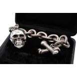 A 19TH CENTURY MEMENTO MORI MUSICAL REPEATER SKULL WATCH AND ALBERT CHAIN