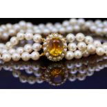 3-ROW PEARL NECKLACE WITH A CITRINE CLASP