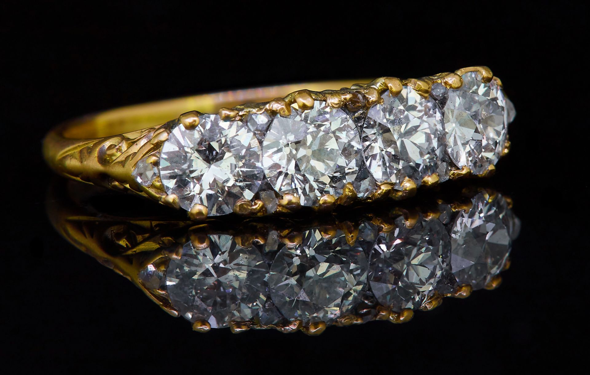 ANTIQUE 4-STONE DIAMOND RING