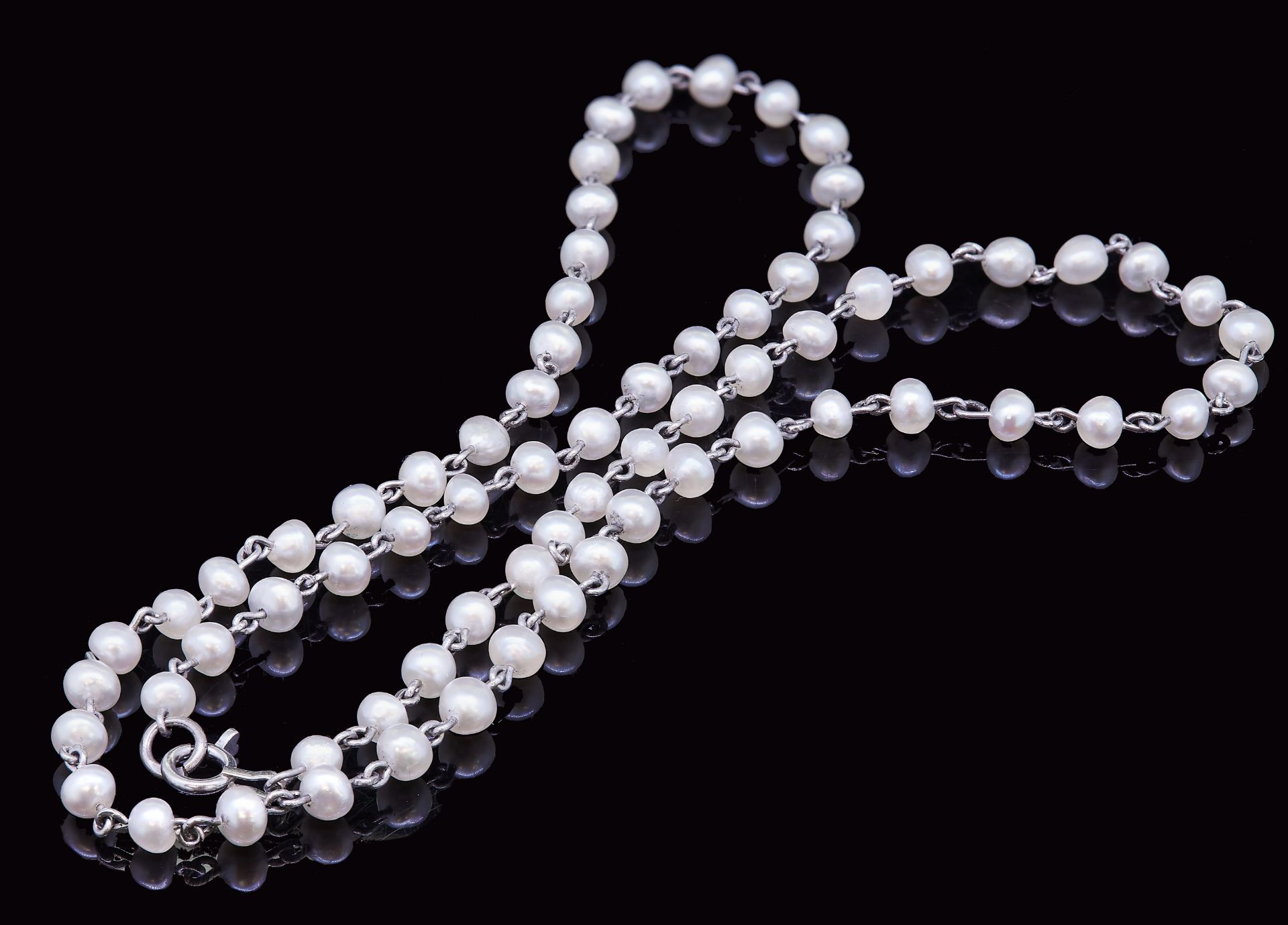 AN ART DECO PEARL CHAIN NECKLACE