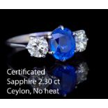 IMPORTANT CEYLON BLUE SAPPHIRE AND DIAMOND 3-STONE RING