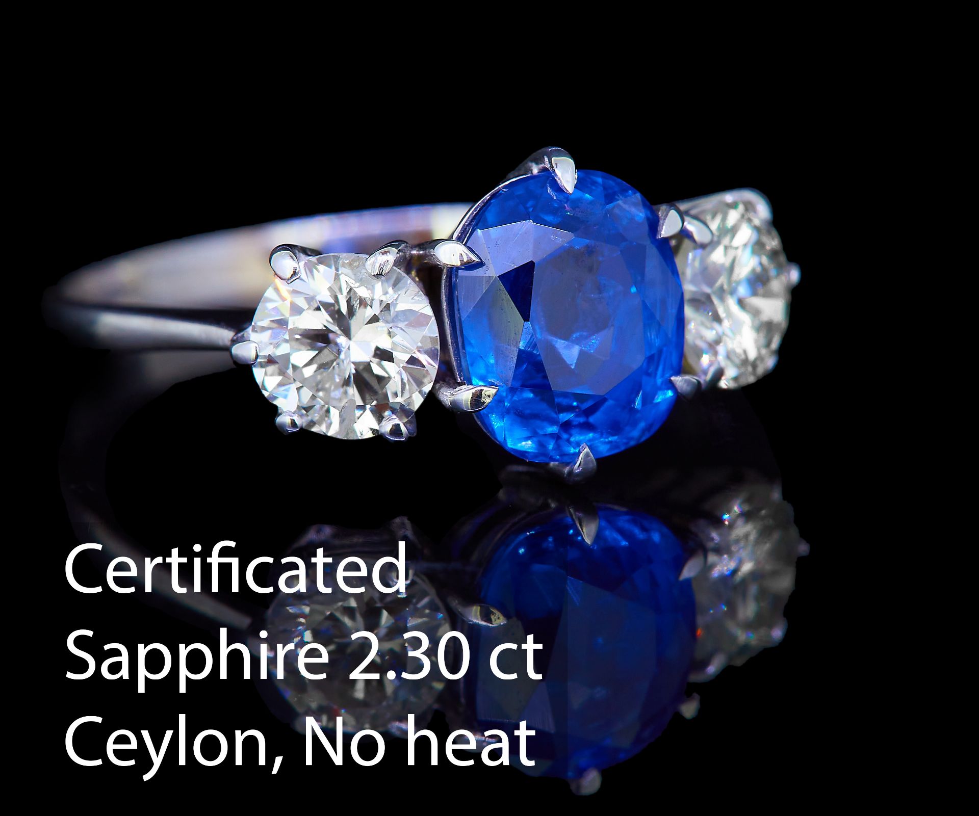 IMPORTANT CEYLON BLUE SAPPHIRE AND DIAMOND 3-STONE RING