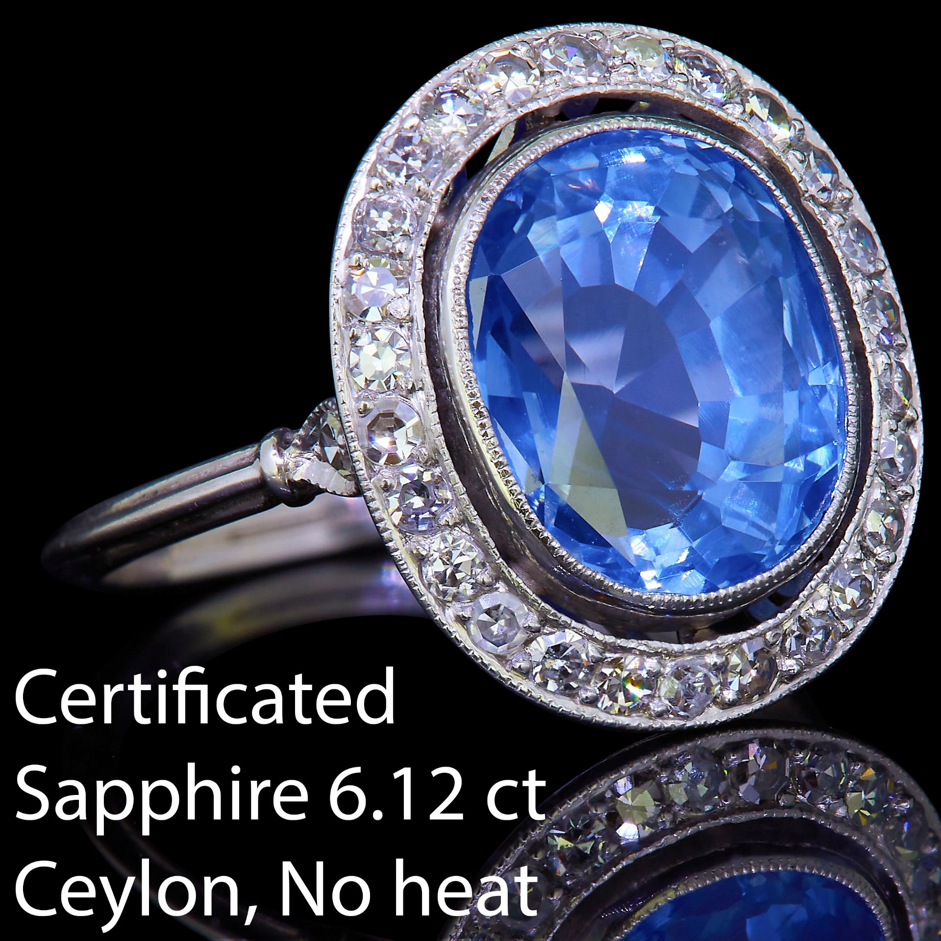 IMPORTANT 6.12 CT. CEYLON BLUE SAPPHIRE AND DIAMOND CLUSTER RING