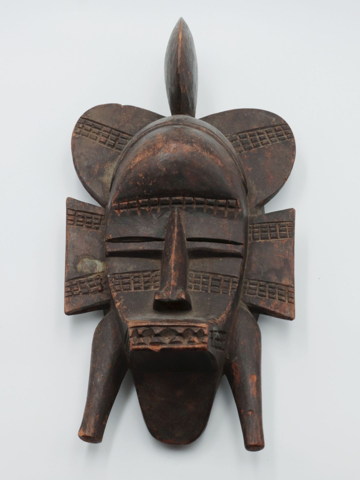 Maske 20.Jh., Elfenbeinküste, vollplastische Holzschnitzerei, wohl Tropenholz, Gesicht m. schmalen