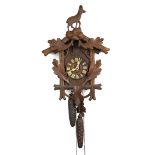 Kuckucks - Uhr um 1900klassischer Holzkorpus mit aufgelegtem Eichenlaub, Kuckuck hinte
