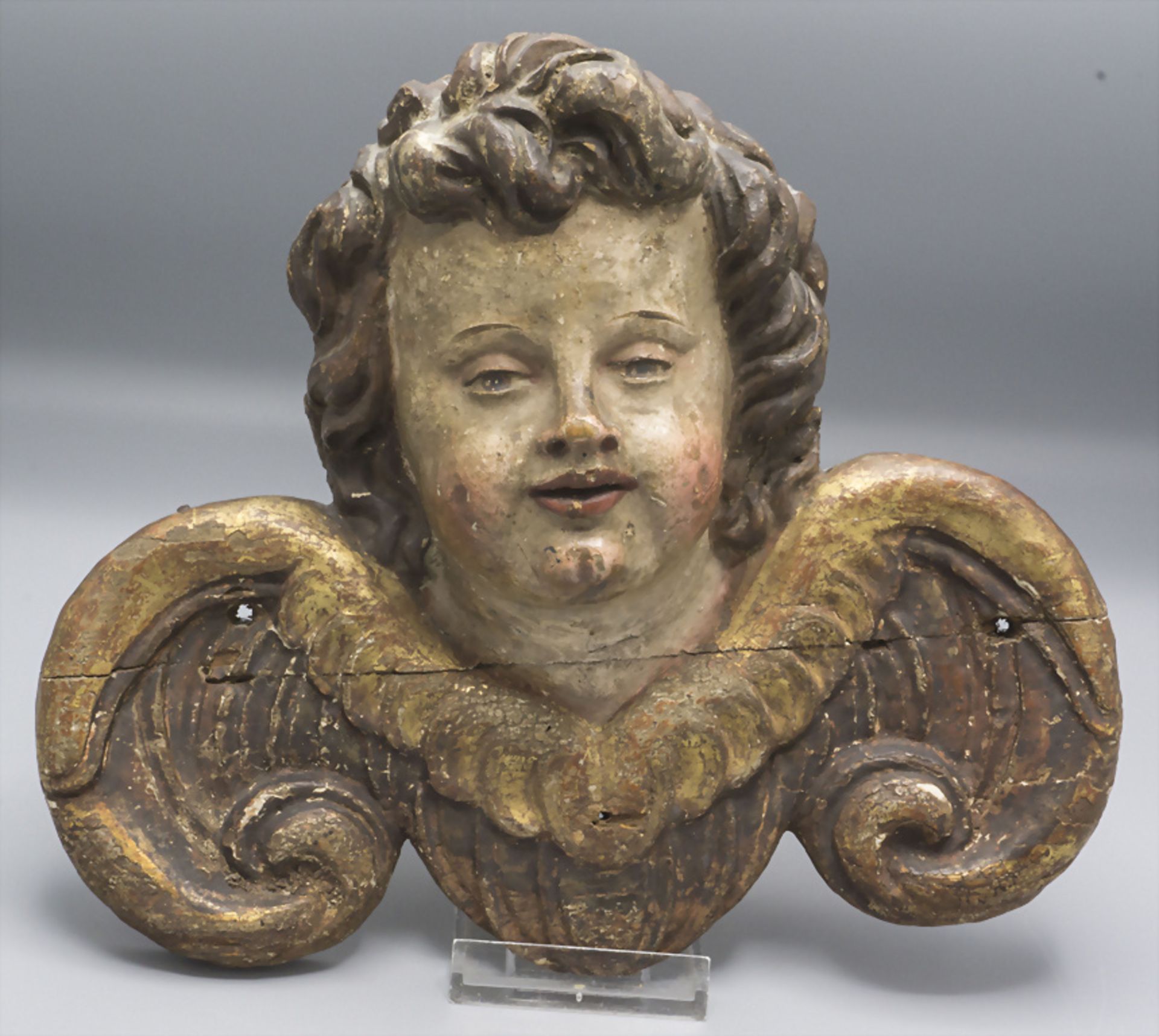 Puttokopf als Hängeskulptur / A head of a putto as hanging sculpture, Süddeutschland, 18. Jh.