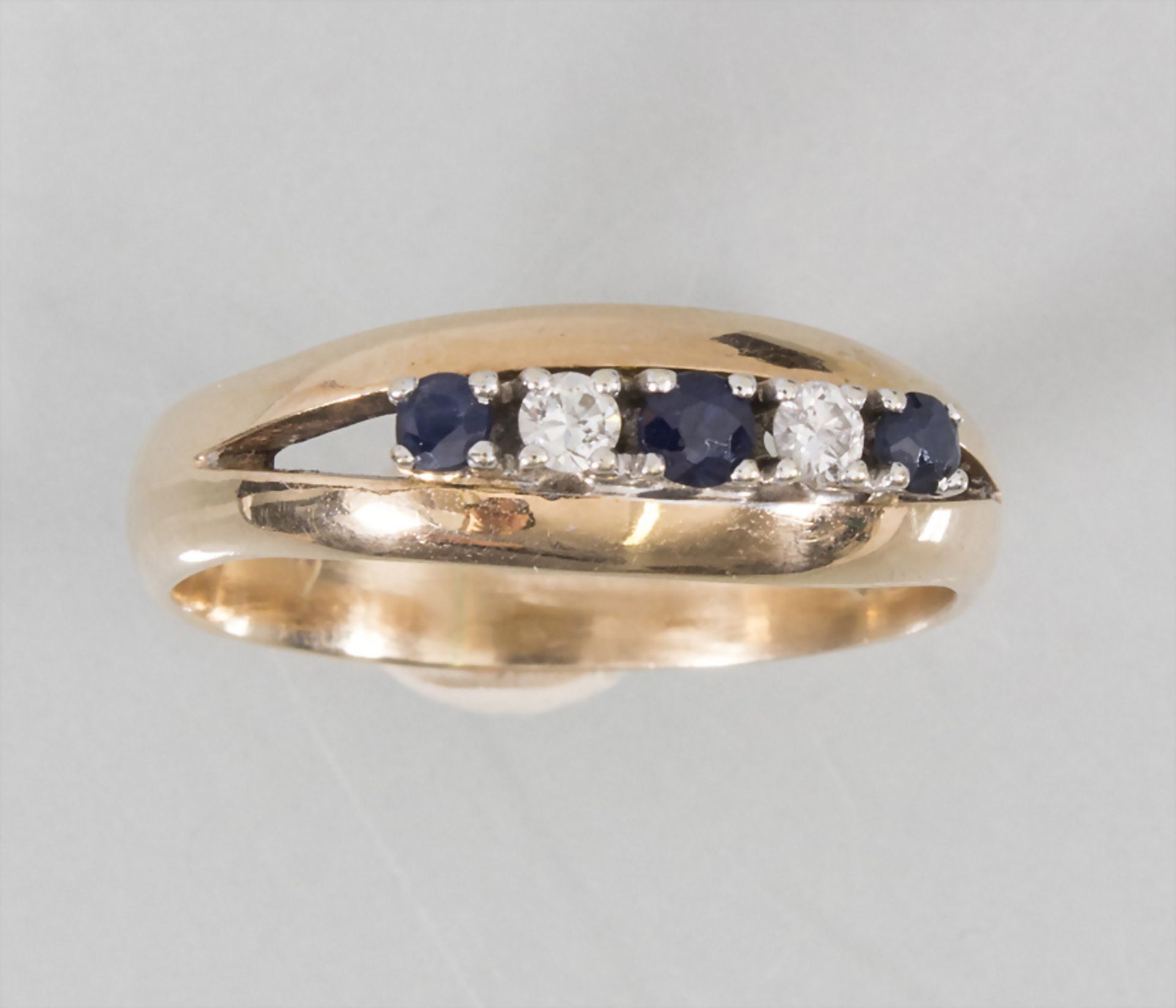 Damenring mit Diamant und Saphir / A ladies 14k gold ring with diamonds and sapphires