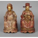 Paar asiatische Ahnenfiguren wohl China, 19. Jh., Holz geschnitzt, farbig gefasst und vergoldet,