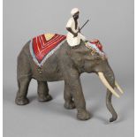 Lineol Elefant und Beduine um 1950, gemarkt, Masse farbig gefasst, schreitender Elefant mit