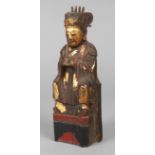 Figur eines Beamten China, um 1900, Holz geschnitzt und farbig gefasst, blattvergoldet, rückseitig