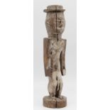 Male figure with sword and western hat. Probably the Congo Basin.