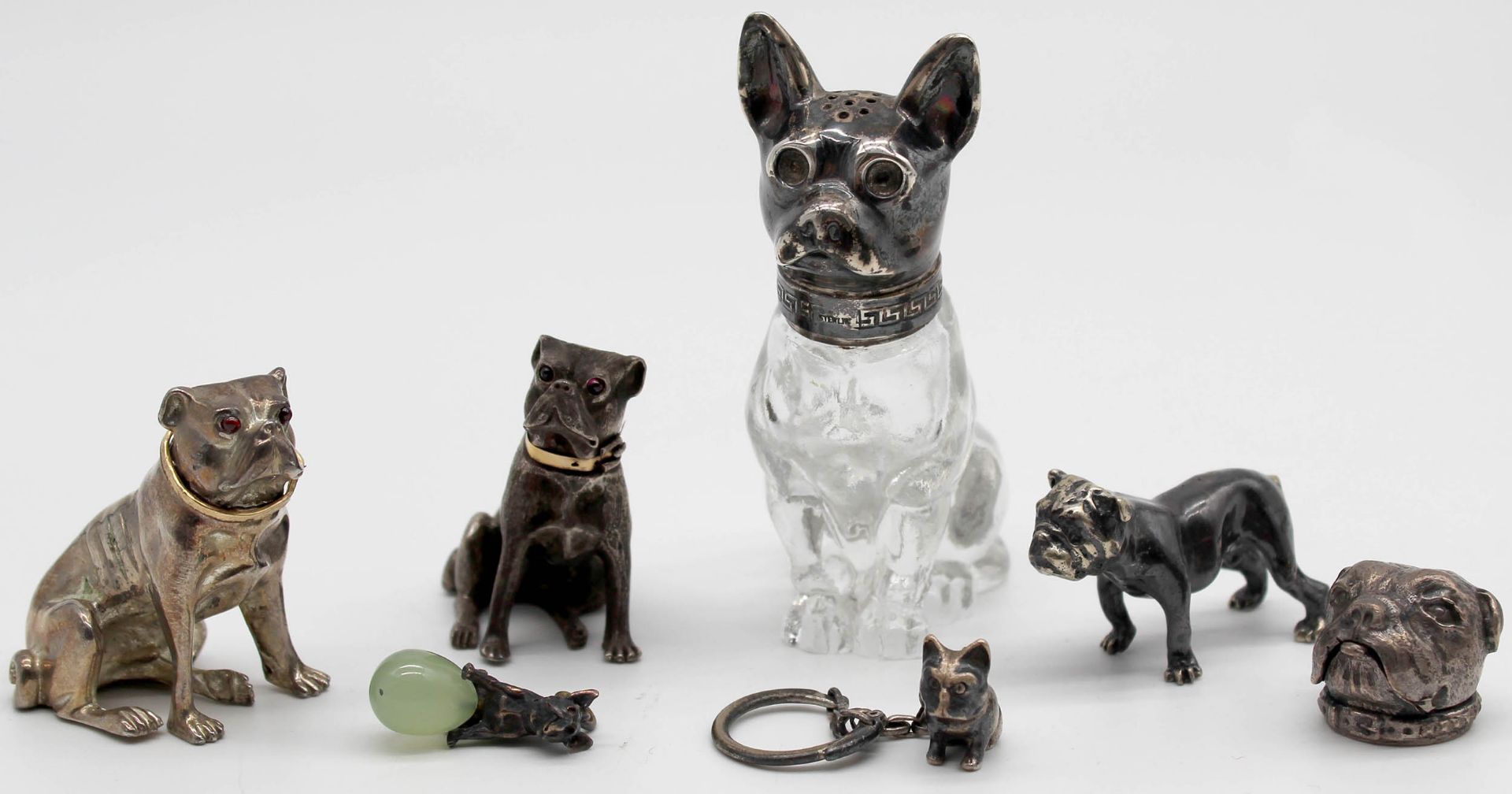 7 figures pug? Partly with silver. Also salt shaker, pillbox.