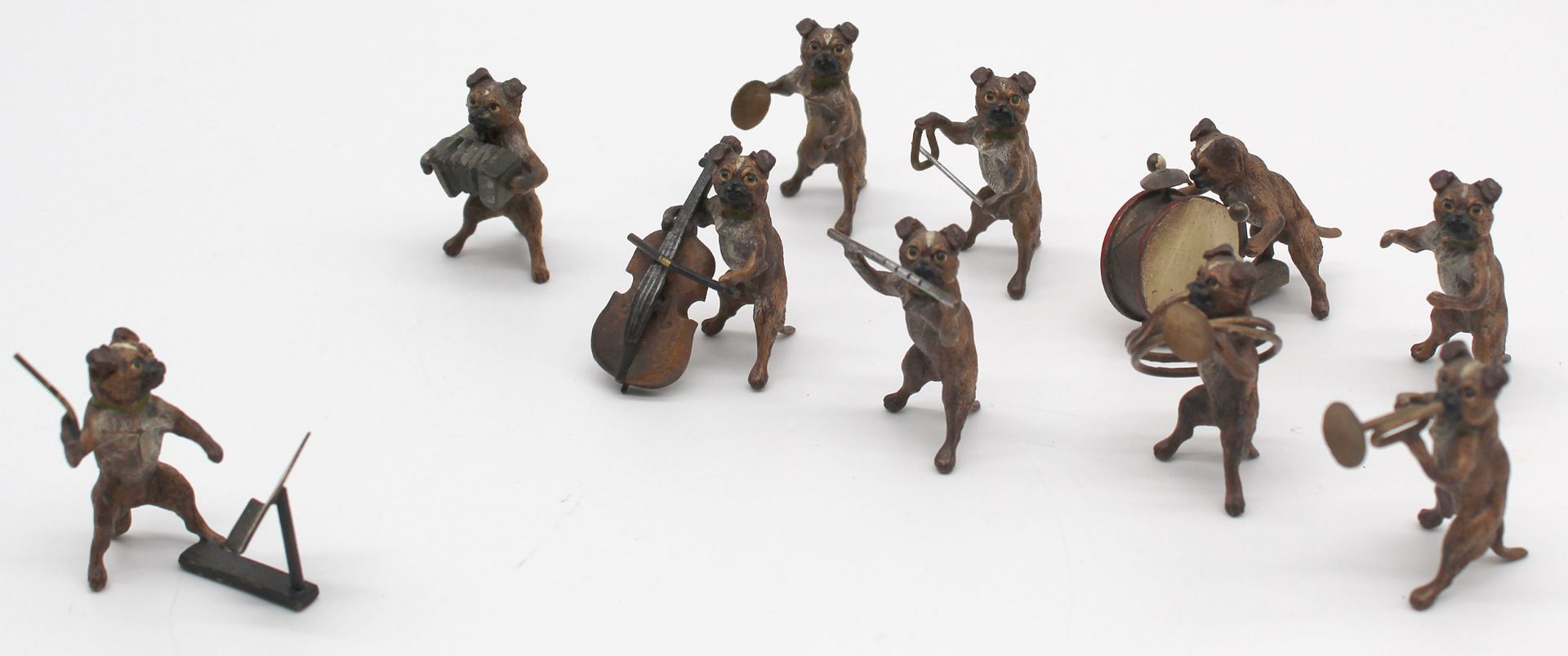 Dog band. 10 small bronzes. Cold painted. Vienna? Up to 4.5 cm high.