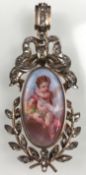 Pendant with porcelain painting in a gold frame with diamonds.