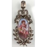 Pendant with porcelain painting in a gold frame with diamonds.