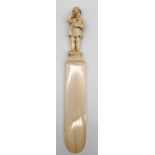 Ivory around 1900. Probably Erbach. Page turner with child figure.