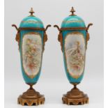 Two lidded cups around 1900. Porcelain. With "bronze dore" mounts.