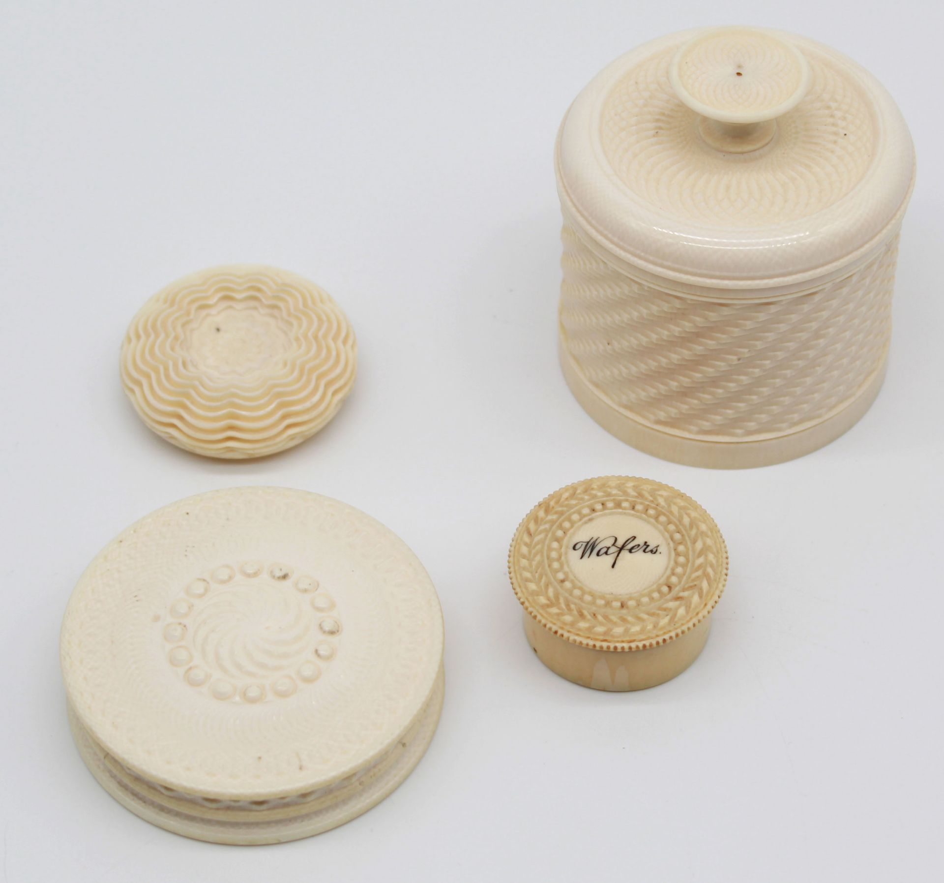 4 tins, probably ivory, 19th century.