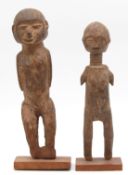2 female figures. One with a long neck and ribbons. Probably Ndebele, South Africa.