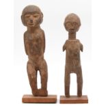 2 female figures. One with a long neck and ribbons. Probably Ndebele, South Africa.