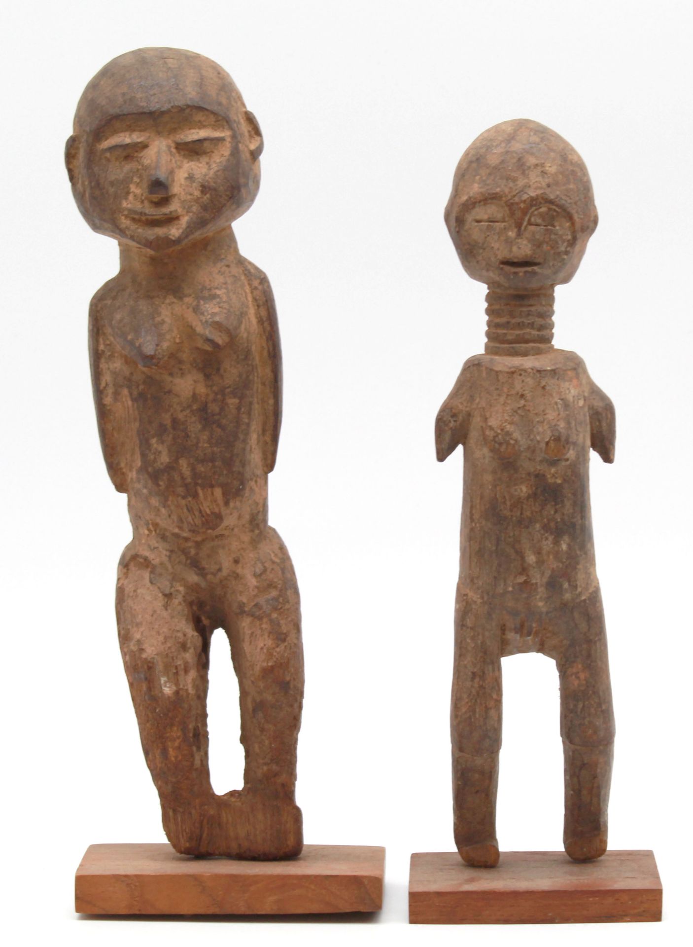 2 female figures. One with a long neck and ribbons. Probably Ndebele, South Africa.