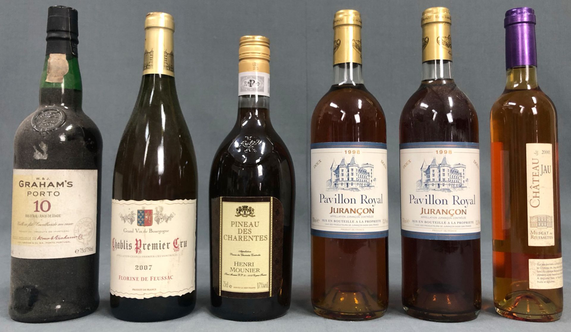5 bottles of France white wine and a bottle Graham Port.