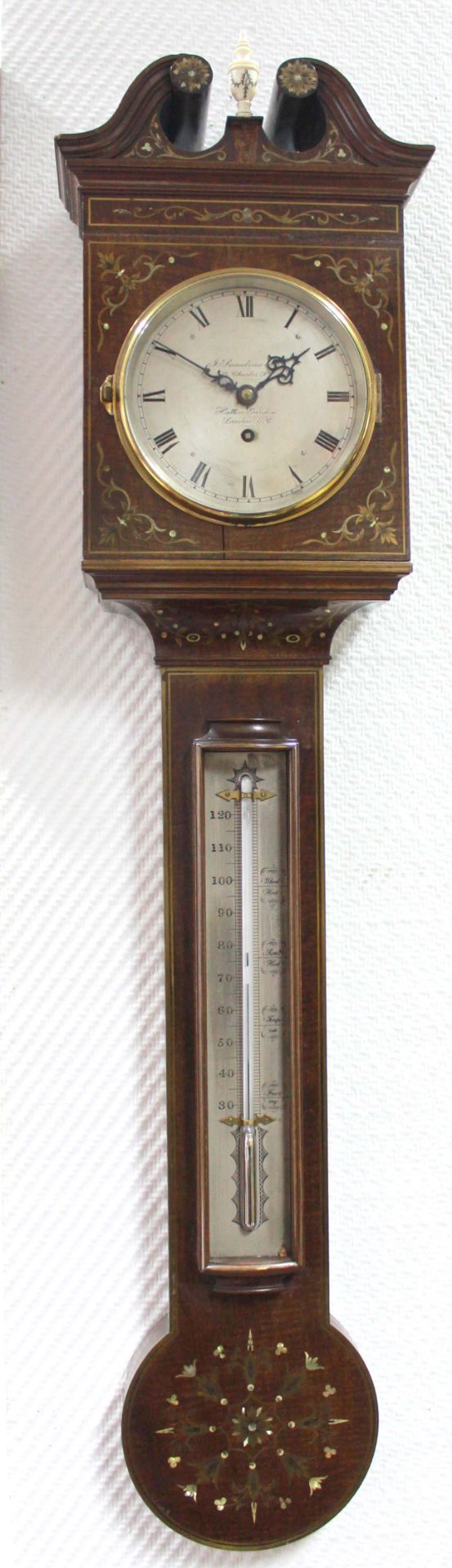 Wall clock with thermometer. "J. Somalvico Co. London".