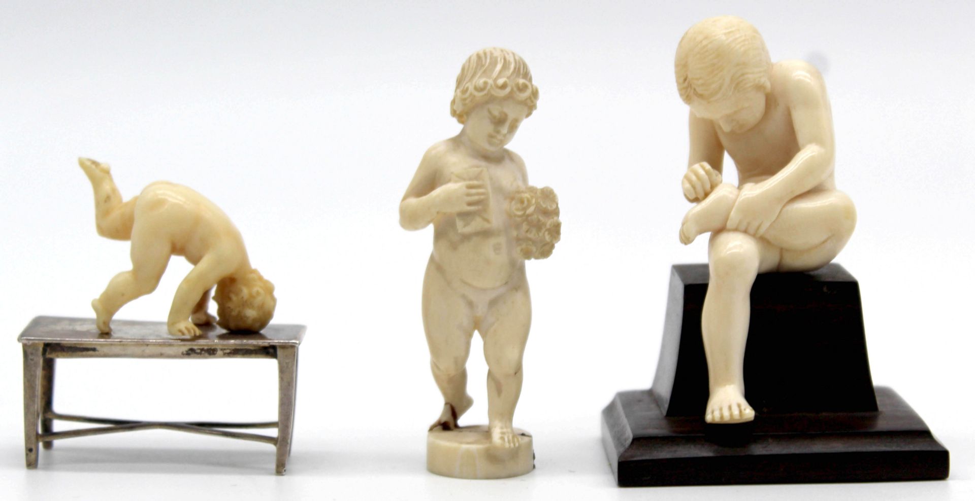 3 figures, boys, ivory around 1900. Probably Erbach.