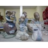 Five pieces of Lladro including a large figurine of a seated girl, plus four smaller figurines