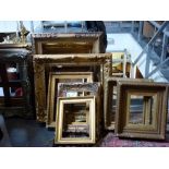 A collection of antique and vintage vacant picture frames comprising rectangular gilt and parcel-
